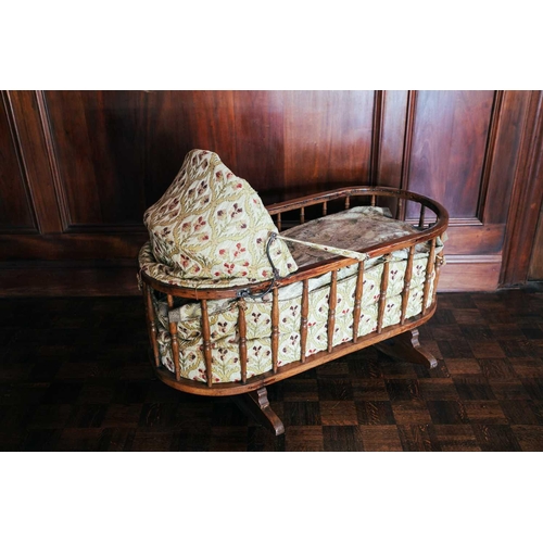 57 - An oak spindle frame child's cot, 19th century, with fitted drapery, 108 cm long x 49 cm wide x 80 c... 