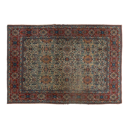 24 - An antique ivory ground Kerman rug with an allover floral design within multiple borders 202 x 137cm... 