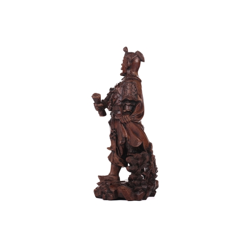 254A - A Chinese carved cherrywood figure of Guan Gong (The God Of War) , 19th/20th century carved in the r... 