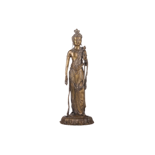 257A - After Takamura Koun, a gilt bronze figure of Kannon with lotus sceptre in the standing teaching mudr... 