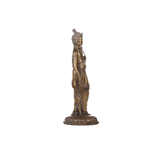 257A - After Takamura Koun, a gilt bronze figure of Kannon with lotus sceptre in the standing teaching mudr... 