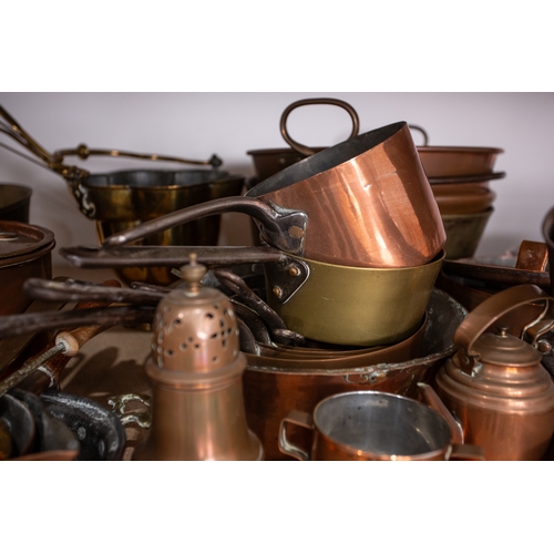 84 - A large collection of copper pans, kettles, preserve pans, measures, jugs, and other items, together... 