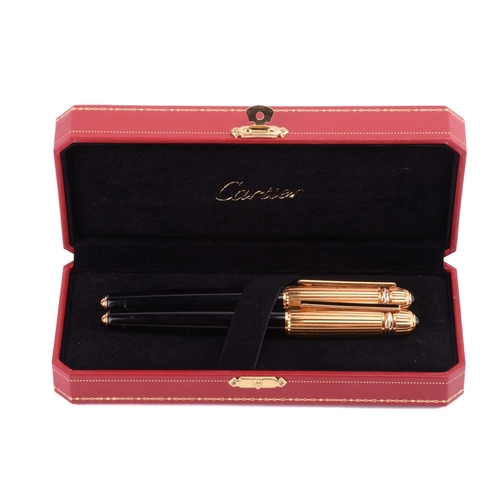 Pasha de Cartier a ballpoint pen and a fountain pen set both