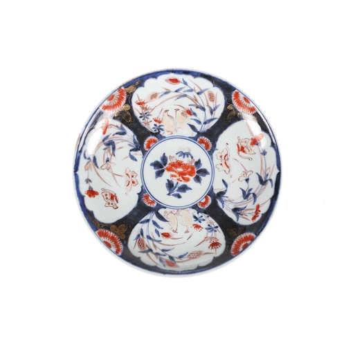 112 - A Japanese Imari porcelain circular dish, Edo period,1st quarter of the 19th century, painted in the... 