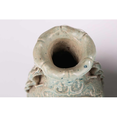 120 - A Chinese celadon glazed porcelain baluster vase decorated in high relief with an immortal accompani... 