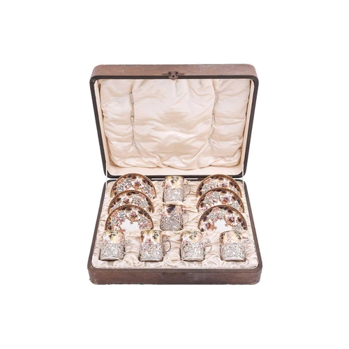 358 - An Edwardian silver-mounted Royal Crown Derby coffee set, comprising six coffee cans and saucers, da... 