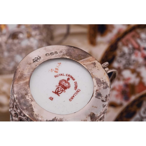 358 - An Edwardian silver-mounted Royal Crown Derby coffee set, comprising six coffee cans and saucers, da... 