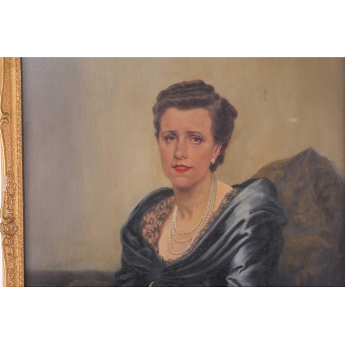 37 - Early 20th-century British school, a half-length portrait of a lady in a blue dress, oil on canvas, ... 