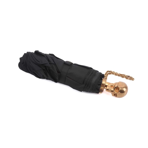 Alexander McQueen - a black folding umbrella with gold-tone