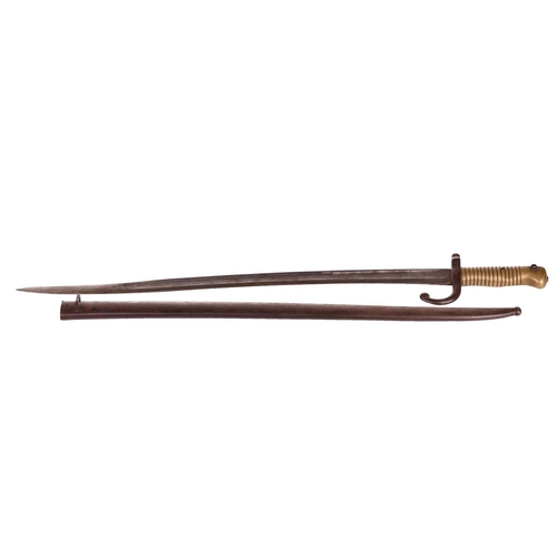 300 - A late 19th-century French Chassepot sword bayonet and scabbard with a double fullered curved blade,... 