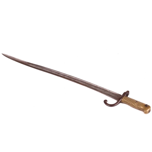 300 - A late 19th-century French Chassepot sword bayonet and scabbard with a double fullered curved blade,... 