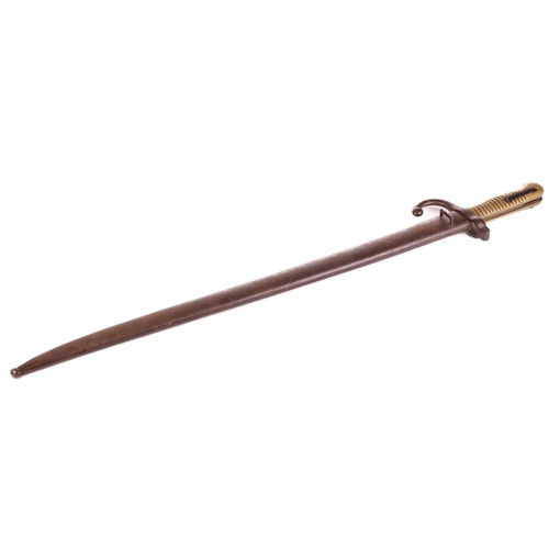 300 - A late 19th-century French Chassepot sword bayonet and scabbard with a double fullered curved blade,... 