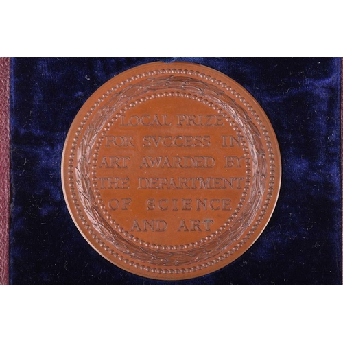 335 - A Victorian bronze medal for the 'Science and Art Department', in fitted case, the edge named to Dow... 