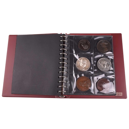 336 - A varied collection of coins, medals and tokens, contained in two albums, to include two Edward I si... 