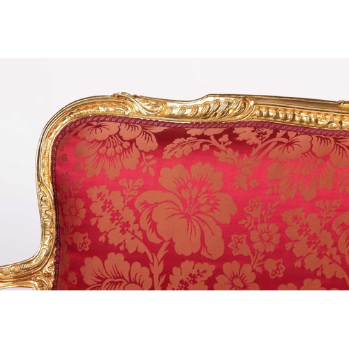 164 - A 20th century Louis XV-style canape settee, with carved and molded wood and gilt gesso outline, stu... 