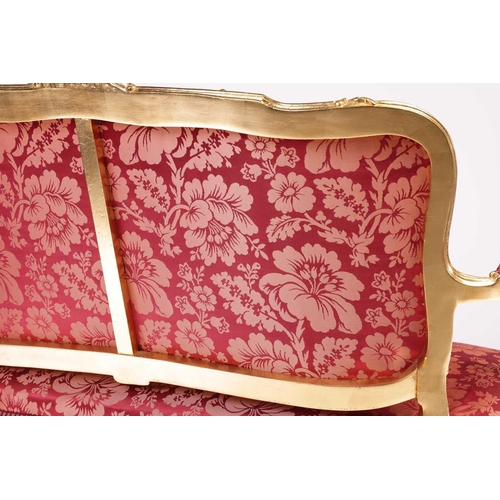 164 - A 20th century Louis XV-style canape settee, with carved and molded wood and gilt gesso outline, stu... 