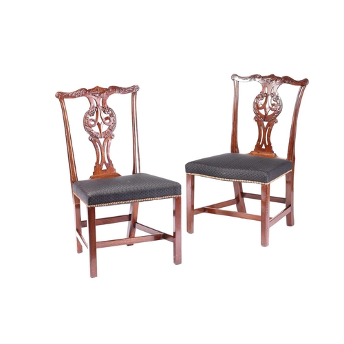 174 - A matched set of ten Chippendale style, George III and later mahogany dining chairs, leaf-capped cup... 