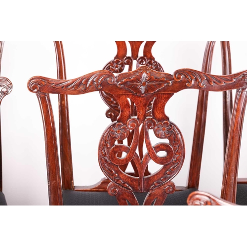 174 - A matched set of ten Chippendale style, George III and later mahogany dining chairs, leaf-capped cup... 