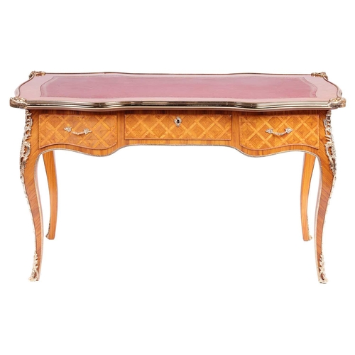 175 - A 20th century Louis XV style cartouche topped bureau plat with tooled leather insert, gilt metal mo... 