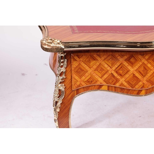 175 - A 20th century Louis XV style cartouche topped bureau plat with tooled leather insert, gilt metal mo... 