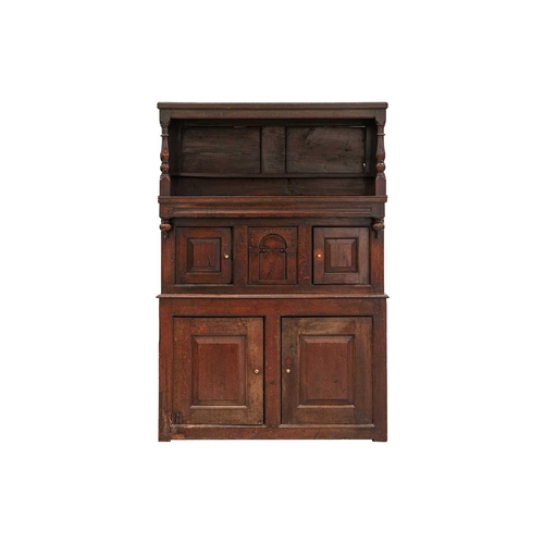 176 - An 18th century Wesh oak Cwpwrdd Tridarn cupboard with open hutch top over a middle tier of shaped p... 