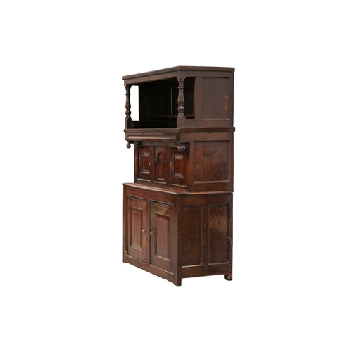 176 - An 18th century Wesh oak Cwpwrdd Tridarn cupboard with open hutch top over a middle tier of shaped p... 