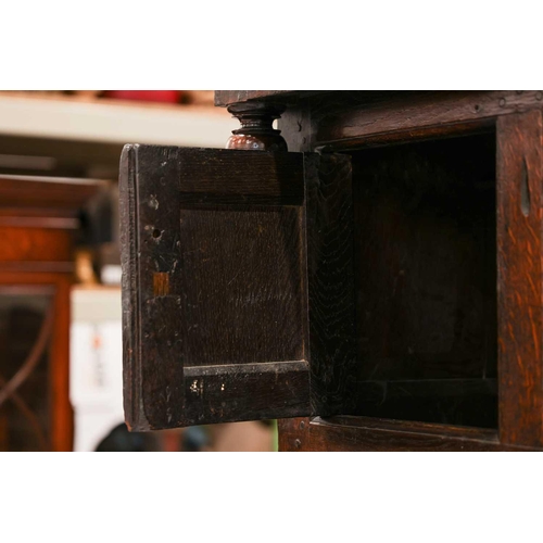 176 - An 18th century Wesh oak Cwpwrdd Tridarn cupboard with open hutch top over a middle tier of shaped p... 