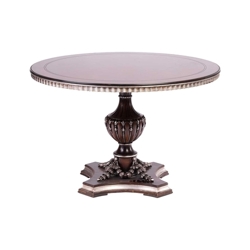 177 - A contemporary circular dining table with swag decoration and silvered detail, raised on a single pe... 