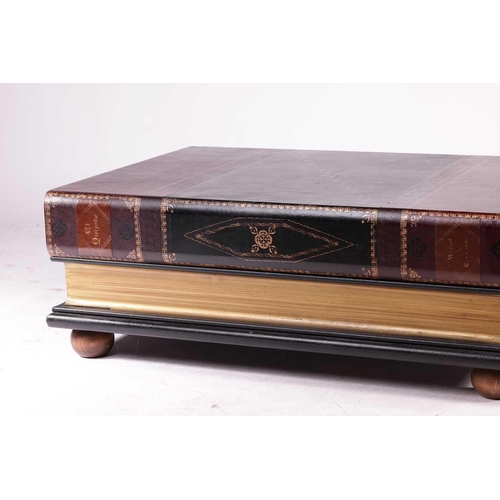 180 - A large rectangular coffee table in the form of two oversized faux leather-bound books, with a singl... 