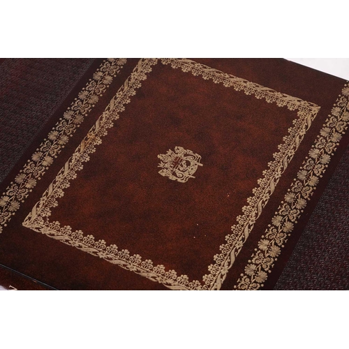 180 - A large rectangular coffee table in the form of two oversized faux leather-bound books, with a singl... 