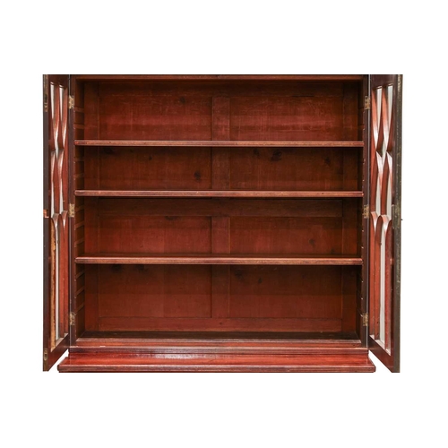 183 - A George IV mahogany secretaire bookcase, the upper section with a pair of eliptical glazed doors, t... 