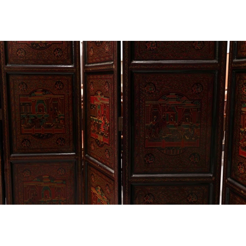 187 - A Burmese black and red lacquered five-fold boudoir screen each panel decorated with scenes of figur... 