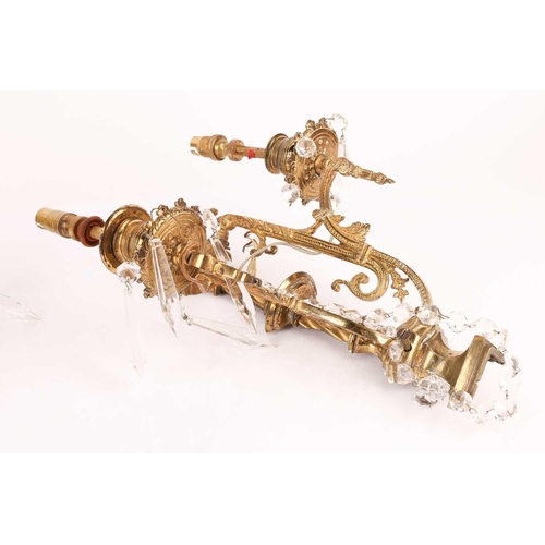 188 - A pair Neo neo-classical gilt brass two-sconce wall lights with central columns, each branch with br... 