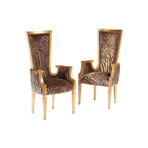 190 - A set of four carved and giltwood 'Hollywood Louis' style high backed armchairs with gold flake acce... 