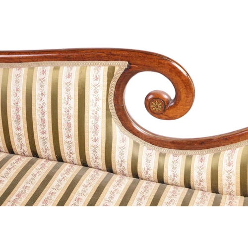 192 - In the manner of John McLean a Regency brass inlaid rosewood double scroll chaise longue, with spent... 