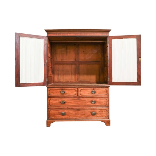 196 - A George III mahogany two-door linen press, now converted for hanging, retaining the long bottom dra... 