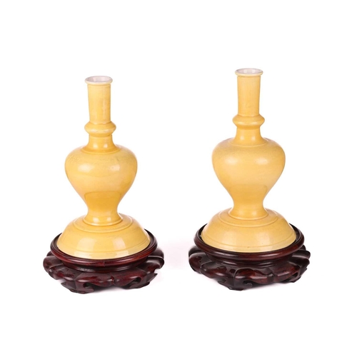 2 - A pair of Chinese yellow ground porcelain vases of heavy baluster form with white interiors, Qing Dy... 