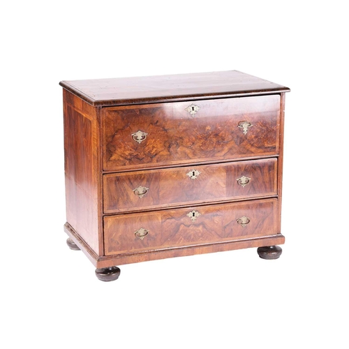 200 - A William & Mary walnut chest of three long drawers, the parquetry top with the central quartered pa... 