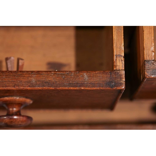 205 - An early 19th century Welsh (Carmarthenshire) oak linen press cupboard, with a pair of double panel ... 