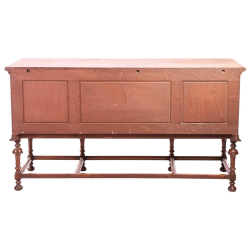 209 - A Morgan and Co. arts and crafts oak sideboard with strung detail to the doors, raised on turned tru... 