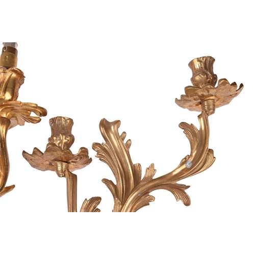 211 - A pair of Louis XV-style ormolu effect double sconce wall lights with foliate scroll arms and drip p... 