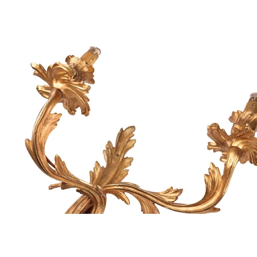 211 - A pair of Louis XV-style ormolu effect double sconce wall lights with foliate scroll arms and drip p... 