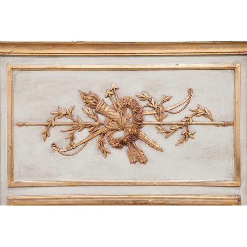 215 - A Louis XVI-style ivory-painted trumeau mirror with gilt marshall trophy decoration to the frieze, f... 