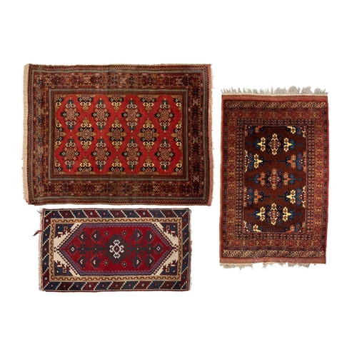 216 - A red ground Turkoman rug with rows of composite guls within reciprocal arrow head borders, 172 cm x... 