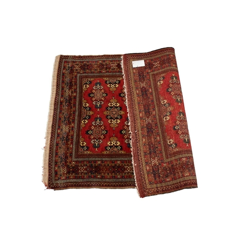 216 - A red ground Turkoman rug with rows of composite guls within reciprocal arrow head borders, 172 cm x... 