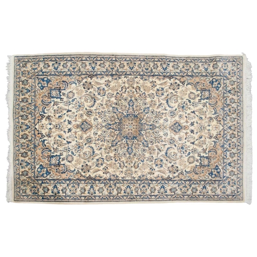 217 - An ivory ground Nain rug with formal bookcover design, within palmette borders. 191 cm x 121 cm A pr... 