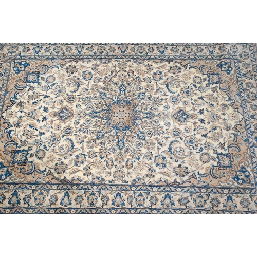 217 - An ivory ground Nain rug with formal bookcover design, within palmette borders. 191 cm x 121 cm A pr... 