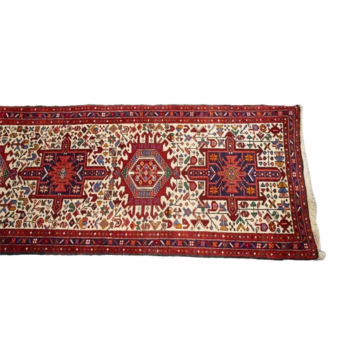 219 - A reg ground Shiraz rug with three stepped diamonds on a centralm pole,160 cm x 123 cm, together wit... 