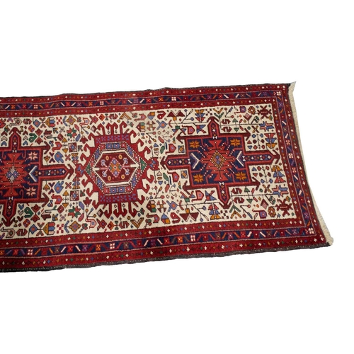 219 - A reg ground Shiraz rug with three stepped diamonds on a centralm pole,160 cm x 123 cm, together wit... 