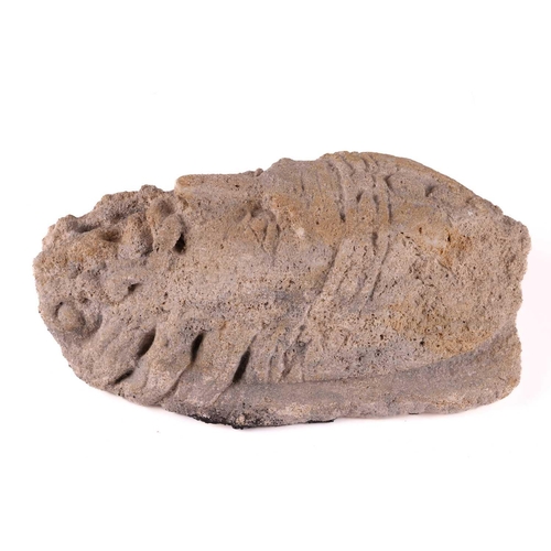 221 - A European carved stone architectural fragment; probably a 15th-century corbel carved as the head of... 